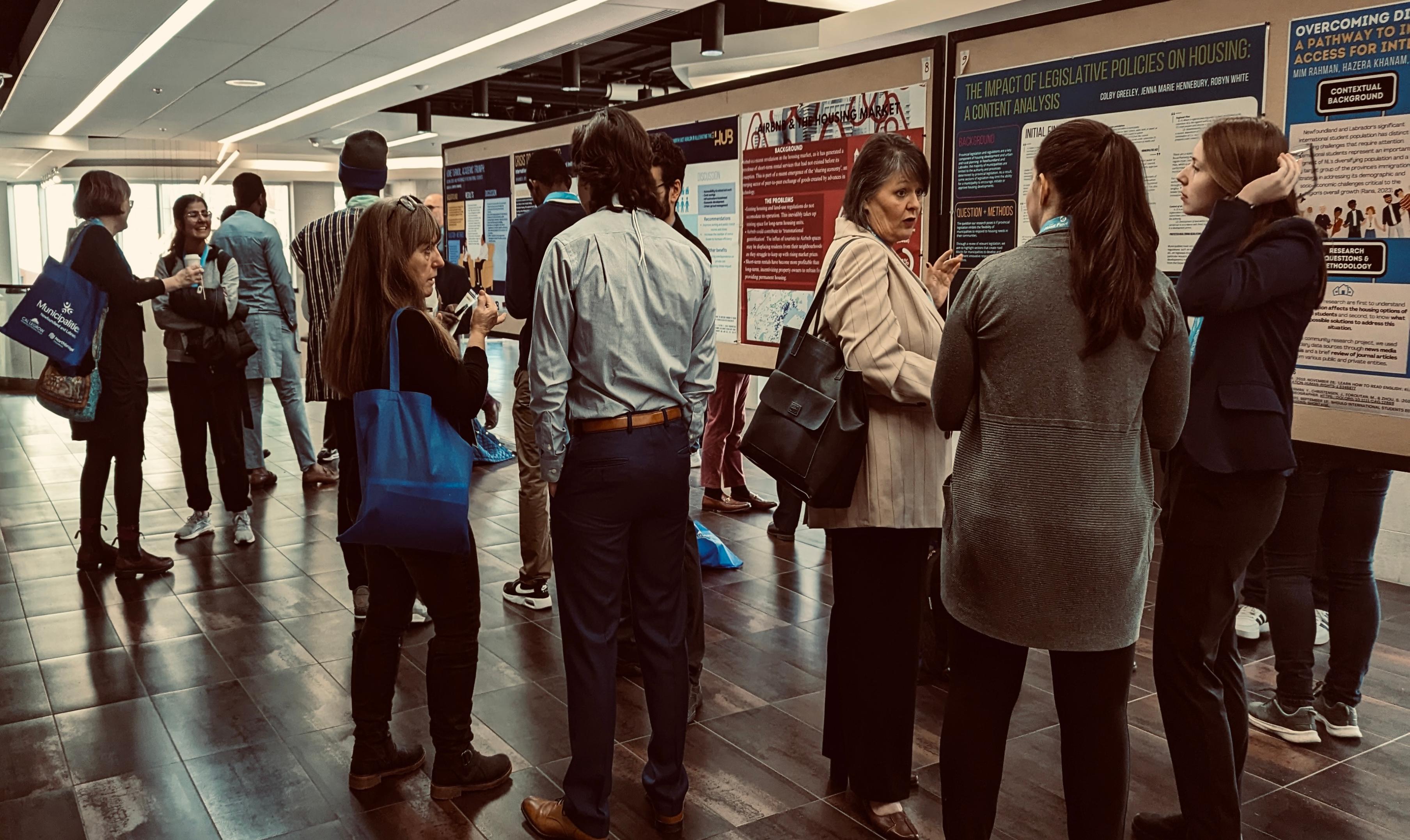 A practitioner discussing a student poster presentation